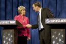 FILE - In this Oct. 7, 2012, file photo U.S. Senate candidates for Connecticut, Republican Linda McMahon and Democratic Rep. Chris Murphy, D-Conn., shake hands after a live televised debate in Rocky Hill, Conn. In the lineup of ticket-splitting races to watch, the race between McMahon an Murphy is one of the biggest surprises and promising opportunities for the GOP in the closing weeks of the campaign. Former professional wrestling executive McMahon, in her second Senate bid, is running even with three-term Murphy in the Democratic-leaning state. (AP Photo/Jessica Hill, File)