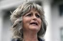 FILE - This Saturday, March 5, 2016, file photo, Jeanette Finicum speaks with reporters during a rally at the Utah State Capitol, in Salt Lake City. Finicum, the widow of an Arizona rancher LaVoy Finicum killed by FBI agents in a Jan. 26, 2016, traffic stop in central Oregon, is planning to hold a meeting in John Day, Ore., Jan. 28, 2017, with their children, in an effort to continue with his mission. (AP Photo/Rick Bowmer, file)