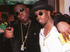 **FILE**In this March 8, 1997 file photo, Notorious B.I.G., whose real name is Christopher Wallace, left, gestures as he and producer Sean "Diddy" Combs leave a party at the Petersen Automotive Museum in Los Angeles late Saturday evening, shortly before Wallace was shot to death. Authorities have unsealed an autopsy report the week of Nov. 26, 2012 showing that rapper Notorious B.I.G. was shot four times in a 1997 drive-by shooting that remains unsolved. (AP Photo/Venus Bernardo-Prudhomme, File)