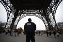 Police patrol on November 14, 2015 at the Eiffel Tower, following a series of coordinated attacks in and around Paris