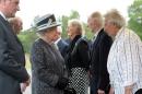 Britain's Queen Elizabeth II and Britain's Prince Philip, Duke of Edinburgh, talk with (LtoR) Doreen Levy, Captain Eric Brown and Anita Lasker-Wallfisch on June 26, 2015
