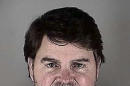 In this photo provided by the Hennepin County, Minn., Sheriff's Office is Fox News anchor Gregg Jarrett. Authorities say Jarrett has been charged with a misdemeanor following his arrest Wednesday, May 21, 2014 at Minneapolis-St. Paul International Airport. An airport spokesman said officers reported Jarrett seemed intoxicated, acted belligerently and refused to follow orders. (AP Photo/Hennepin County Sheriff's Office)