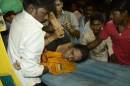 An injured woman is lifted onto a stretcher following a stampede as people celebrated the Dussehra festival, in Patna, in Bihar state, on October 3, 2014