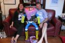 This photo obtained July 31, 2014 shows creators Dr. Frauke Zeller of Ryerson University and Dr. David Harris Smith of McMaster University with hitchBOT