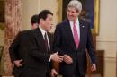 Secretary of State John Kerry walks with Japanese Foreign Minister Fumio Kishida to speak after their meeting at the State Department in Washington, Friday, Feb. 7, 2014. (AP Photo/ Evan Vucci)