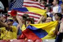 USA and Colombia fans watch warm up's prior to the Copa America Centenario third-place soccer match at University of Phoenix Stadium, Saturday, June 25, 2016, in Glendale, Ariz. (AP Photo/Matt York)