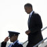 President Barack Obama walks down the steps of Air Force One after arriving at Southwest Florida International Airport in Ft. Myers, Fla., Friday, July 20, 2012. Obama is cutting short a Florida campaign swing following the deadly Colorado movie theater shooting. He called the shooting "horrific". (AP Photo/Susan Walsh)