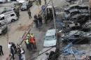 Lebanese security forces and forensic experts at the site of an explosion in southern Beirut on January 22, 2014