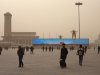 In this Feb. 28, 2013 photo, a giant electronic screen on Tiananmen Square shows an image of Tiananmen Gate under a blue sky as part of a propaganda video on a polluted day in Beijing. While the numbers are hard to quantify, executive recruitment consultants say they are noticing that it is becoming harder to attract top talent to China - both expats and Chinese nationals educated abroad. If the polluted skies continue, companies may have to fork out more money for their workers, settle for less qualified candidates or hire local workers instead of expats.(AP Photo/Alexander F. Yuan)