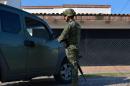 A member of the Mexican Navy stands guard in a street of Culiacan, Sinaloa state, Mexico, during a security operation on October 20, 2015