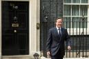 British Prime Minister David Cameron, pictured walking out of 10 Downing Street on July 15, 2015, is to announce a five-year plan to tackle home-grown Islamic extremism and help communities integrate in Britain
