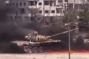A YouTube image grab on August 27, 2013 allegedly shows smoke billowing from a government tank in a Damascus suburb