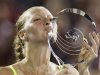 Czech Republic's Kvitova kisses the championship trophy after her win over China's Li during their women's singles final match at the Rogers Cup tennis tournament in Montreal