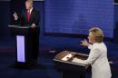 FILE - In this Oct. 19, 2016 file photo, Democratic presidential nominee Hillary Clinton and Republican presidential nominee Donald Trump debate during the third presidential debate at UNLV in Las Vegas. Headed for history books, the duel between Hillary Clinton and Donald Trump became a battle of 