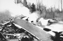 FILE - This Dec. 12, 1985, file photo, shows the wreckage of Arrow Air Flight 1285 after the plane crashed in Gander, Newfoundland, killing all 256 passengers and crew on board. The plane crash was among Canada's deadliest accidents in the last 150 years, killing 256. Police say 50 people are presumed dead following a July 6, 2013, fiery oil train crash in Lac-Megantic, Quebec, making it Canada's worst railway crash in nearly 150 years. (AP Photo, File)