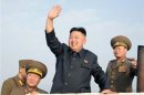 North Korean leader Kim Jong-Un waves as he visits military units on islands in the most southwest of Pyongyang