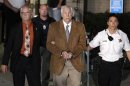 Former Penn State University assistant football coach Jerry Sandusky, center, leaves the Centre County Courthouse in custody with Centre County Sheriff Denny Nau, left, after being found guilty of multiple charges of child sexual abuse in Bellefonte, Pa., Friday, June 22, 2012. Sandusky was convicted of sexually assaulting 10 boys over 15 years, accusations that had sent shock waves through the college campus known as Happy Valley and led to the firing of Penn State's beloved Hall of Fame coach, Joe Paterno. (AP Photo/Gene J. Puskar)