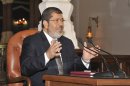 In this photo released by the Egyptian Presidency, President-elect Mohammed Morsi speaks to newspaper editors in Cairo, Egypt, Thursday, June 28, 2012. (AP Photo/Egyptian Presidency)