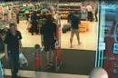 In this image made available by South Wales Police shows a video image Alan Knight,of Swansea south Wales, right, in a supermarket in Bishopís Cleeve in western England in June 2014. Alan Knight a fraudster who pretended to be quadriplegic and sometimes comatose for two years to avoid prosecution has been convicted after police caught him on camera driving and strolling around supermarkets. Alan Knight of Swansea, Wales, stole more than 40,000 pounds ($64,000) from the bank account of an elderly neighbor with Alzheimer's disease, prosecutors said. (AP Photo/South Wales Police)