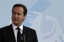 British Prime Minister Cameron givestatement to media before bilateral talks with German Chancellor Merkel in Berlin