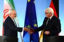 German foreign minister Frank-Walter Steinmeier (R) welcomes his Iranian counterpart Mohammad Javad Zarif on January 15, 2015, in Berlin