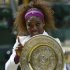Serena Williams of the U.S. holds her trophy after defeating Agnieszka Radwanska of Poland in their women's final tennis match at the Wimbledon tennis championships in London