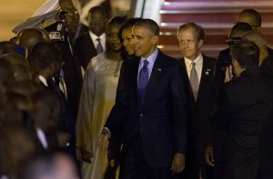 U.S. President Barack Obama, center, accompanied by …