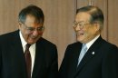 U.S. Secretary of Defense Leon Panetta, left, smiles with Japan's Defense Minister Satoshi Morimoto at the Ministry of Defense in Tokyo, Monday, Sept. 17, 2012. (AP Photo/Larry Downing, Pool)