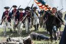 In this 2014 photo released by the History Channel, actors portray Revolutionary War soldiers in a scene from "Sons of Liberty," a new miniseries premiering in January 2015 on the History Channel. (AP Photo/History Channel, Ollie Upton)