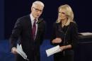 Moderators Anderson Cooper, of CNN, and Martha Raddatz, of ABC News talk to the audience before the second presidential debate at Washington University in St. Louis, Sunday, Oct. 9, 2016. (AP Photo/Julio Cortez)