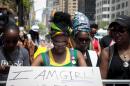 Activists pause during a prayer vigil for abducted Nigerian schoolgirls in front of the Consulate General of Nigeria in Manhattan, New York
