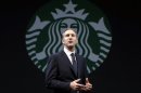 FILE - In this Wednesday, March 20, 2013, file photo, Starbucks CEO Howard Schultz speaks at the company's annual shareholders meeting,in Seattle, Wash. Starbucks Corp. reports quarterly financial results after the market closes on Thursday, April 25, 2013. (AP Photo/Ted S. Warren)