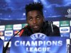 Barcelona's Alex Song answers a question during a press conference ahead of their Champions League soccer match against Celtic in Glasgow, Scotland