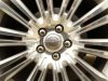 A Chrysler logo is seen on the wheel of a new car at a dealership in Virginia