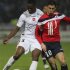 Valenciennes's Ifimat Mirin fights for the ball with Lille's Hazard during their French Ligue 1 soccer match at Stadium Villeneuve d'Ascq