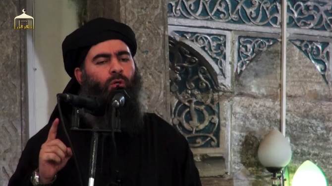 An image grab taken from a propaganda video released on July 5, 2014 by al-Furqan Media allegedly shows the leader of the Islamic State (IS) jihadist group, Abu Bakr al-Baghdadi, aka Caliph Ibrahim, adressing Muslim worshippers at a mosque in Mosul