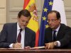 Spain's Prime Minister Mariano Rajoy, left, and French President Francois Hollande, sign cooperation agreements during a Franco-Spanish summit at the Elysee Palace, in Paris,  Wednesday, Oct. 10, 2012. (AP Photo/Philippe Wojazer, Pool)