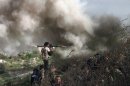 A video grab shows an opposition fighter on August 26, 2013 during clashes over the strategic area of Khanasser