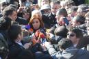 Former Argentine President Cristina Fernandez de Kirchner (C) speaks with reporters outside the Comodoro Py courthouse where she testified before federal judge Claudio Bonadio on charges of fraud, in Buenos Aires on July 6, 2016