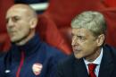 Arsenal's French manager Arsene Wenger (R) looks on before the UEFA Champions League Group F football match between Arsenal and Borussia Dortmund at the Emirates Stadium, north London, on October 22, 2013