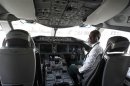 Kebede, an Ethiopian Airlines manager, sits inside the cockpit of their 787 Dreamliner after it arrived at the Jomo Kenyatta international airport in Kenya's capital Nairobi