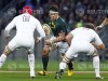 South Africa's Coetzee runs toward England's Johnson and Parling during their third rugby union test match in Port Elizabeth