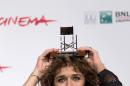 Actress Valeria Golino poses for photographers with the award for best actress for the movie 'Come il Vento' (Like the Wind) by 'L.A.R.A.' an artists' association, during a photo call at the 8th edition of the Rome International Film Festival in Rome, Saturday, Nov. 16, 2013 (AP Photo/Alessandra Tarantino)