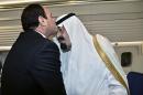 FILE - In this June 20, 2014 file photo provided by the Saudi Press Agency, Egyptian President Abdel-Fattah el-Sissi, left, kisses Saudi Arabia's King Abdullah, inside the king's airplane while parked at the Cairo International Airport in Egypt. El-Sissi scrambled to avert any damage to ties with Arab Gulf countries after he and his aides were allegedly caught on audiotape mocking his crucial oil-rich allies and discussing how to milk them for billions. El-Sissi's phone calls to leaders of Saudi Arabia, Kuwait and the United Arab Emirates on Monday, Feb. 9, 2015, reflected the pivotal role of financial aid from those nations. (AP Photo/SPA, File)