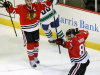 Chicago Blackhawks right wing Marian Hossa (81), from Slovakia, celebrates his second goal of the game with Jonathan Toews (19) during the second period of an NHL hockey game against the Vancouver Canucks Tuesday, Feb. 19, 2013 in Chicago. (AP Photo/Charles Rex Arbogast)