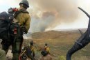 In this photo shot by firefighter Andrew Ashcraft, members of the Granite Mountain Hotshots watch a growing wildfire that later swept over and killed the crew of 19 firefighters near Yarnell, Ariz., Sunday, June 30, 2013. Ashcraft texted the photo to his wife, Juliann, but died later that day battling the out-of-control blaze. The 29-year-old father of four added the message, "This is my lunch spot...too bad lunch was an MRE." (AP Photo/Courtesy of Juliann Ashcraft)