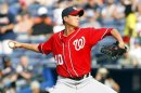 Washington Nationals relief pitcher Chien-Ming Wang of Taiwan throws in the fourth inning against the Atlanta Braves during their MLB National League baseball game at Turner Field in Atlanta