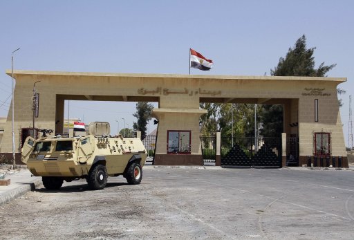 Egyptian soldiers stand guard at the Rafah border crossing between Egypt and Gaza after Egypt closed the crossing following the deadly attack on its soldiers on Sunday