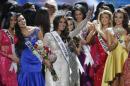 Miss Universe 2013 Gabriela Isler, from Venezuela, center, waves after winning the 2013 Miss Universe pageant in Moscow, Russia, on Saturday, Nov. 9, 2013. (AP Photo/Pavel Golovkin)