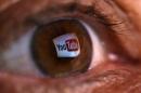 A picture illustration shows a YouTube logo reflected in a person's eye, in central Bosnian town of Zenica